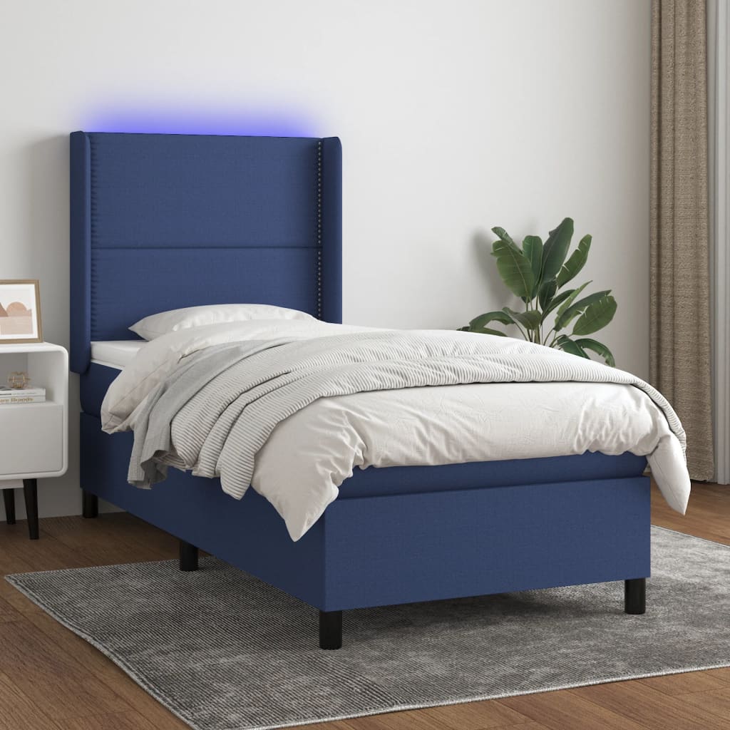 Box spring bed with mattress &amp; LED blue 90x200 cm fabric