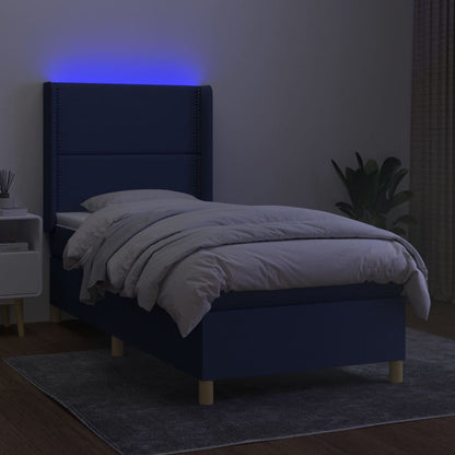 Box spring bed with mattress &amp; LED blue 90x200 cm fabric