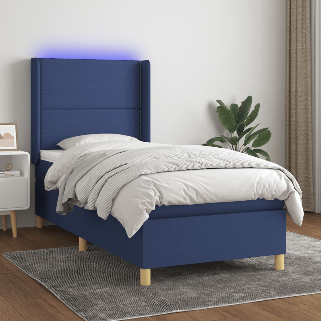 Box spring bed with mattress &amp; LED blue 90x200 cm fabric