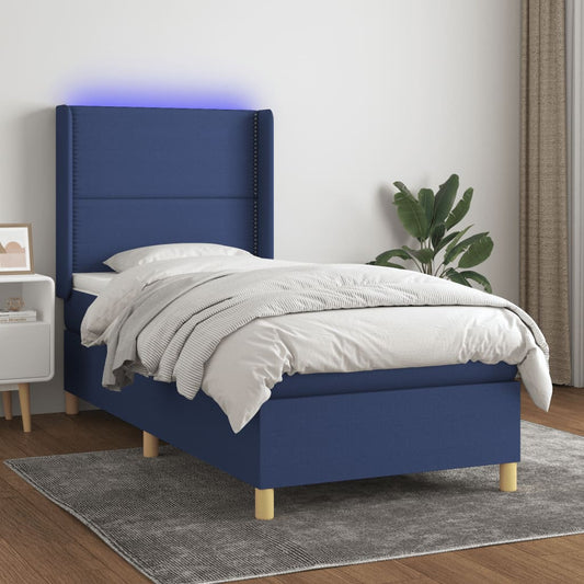 Box spring bed with mattress &amp; LED blue 90x200 cm fabric